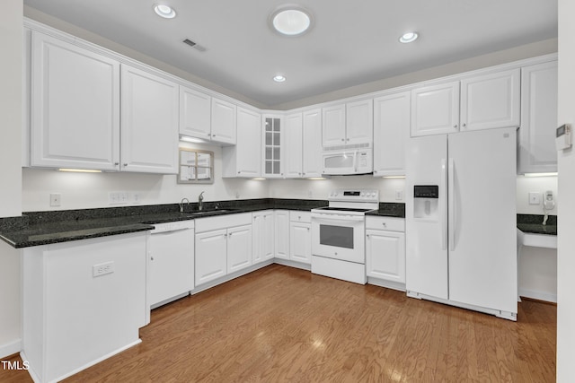 4622 Ludwell Branch Ct, Raleigh, NC 27612 - kitchen with white appliances, light wood-style flooring, white cabinetry, glass insert cabinets, and recessed lighting