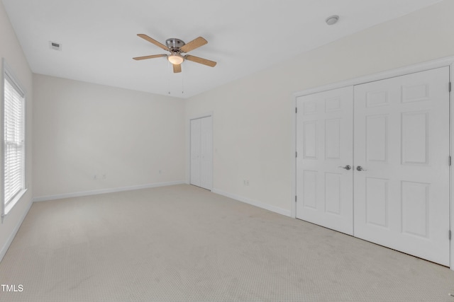 4622 Ludwell Branch Ct, Raleigh, NC 27612 - unfurnished bedroom with two closets, light colored carpet, and a ceiling fan