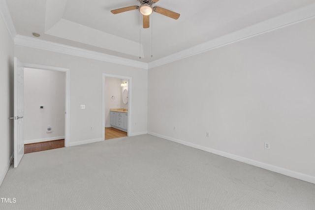 4622 Ludwell Branch Ct, Raleigh, NC 27612 - unfurnished bedroom featuring light colored carpet, a raised ceiling, ensuite bathroom, crown molding, and ceiling fan