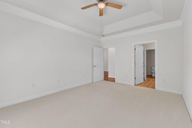 4622 Ludwell Branch Ct, Raleigh, NC 27612 - unfurnished bedroom featuring carpet floors, crown molding, a tray ceiling, ensuite bathroom, and ceiling fan
