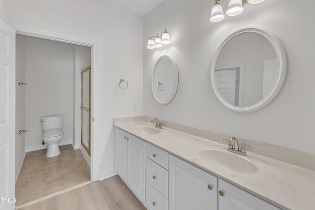 4622 Ludwell Branch Ct, Raleigh, NC 27612 - full bathroom featuring double vanity and a shower with door