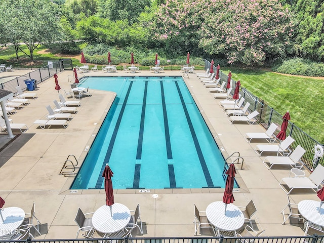 4622 Ludwell Branch Ct, Raleigh, NC 27612 - community pool featuring a patio and view of wooded area