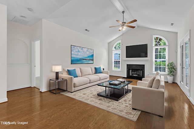 4622 Ludwell Branch Ct, Raleigh, NC 27612 - living room with wood finished floors, healthy amount of natural light, ceiling fan, and a glass covered fireplace