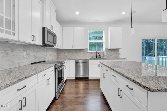 1505 Willow Landing Way, Willow Springs, NC 27592 - kitchen featuring stainless steel appliances, light stone countertops, dark wood finished floors, decorative backsplash, and recessed lighting