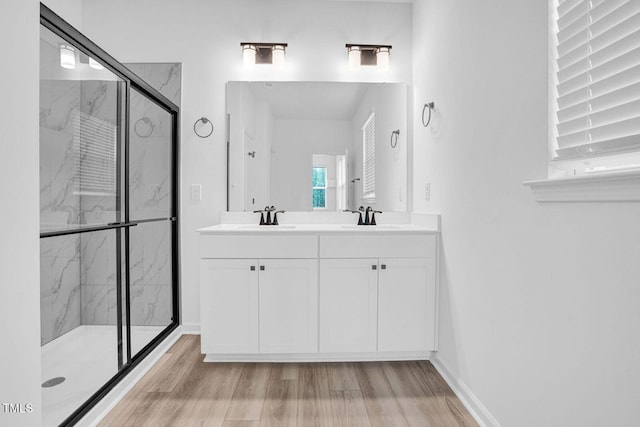 1505 Willow Landing Way, Willow Springs, NC 27592 - full bath with a marble finish shower, wood finished floors, and double vanity