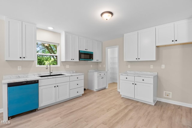 810 Williams St, Burlington, NC 27217 - kitchen with dishwashing machine, light wood-style floors, and white cabinets