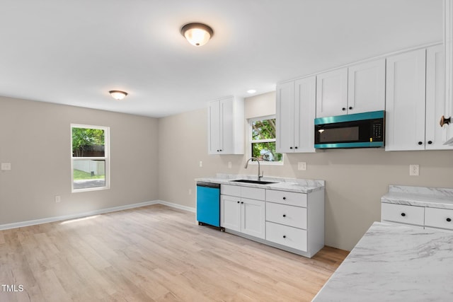 810 Williams St, Burlington, NC 27217 - kitchen featuring stainless steel microwave, dishwasher, plenty of natural light, and light wood-style floors