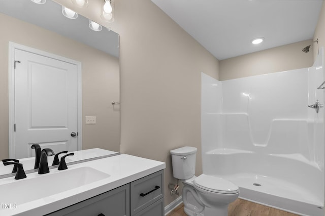 810 Williams St, Burlington, NC 27217 - bathroom with wood finished floors, vanity, and a shower