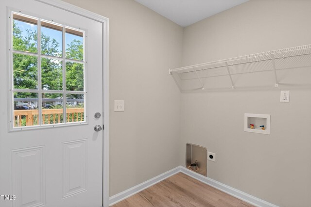 810 Williams St, Burlington, NC 27217 - laundry area with hookup for an electric dryer, light wood-style floors, and washer hookup