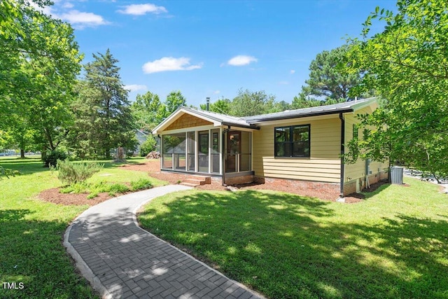 3213 Mid Pines Rd, Raleigh, NC 27606 - back of property featuring a sunroom and a lawn