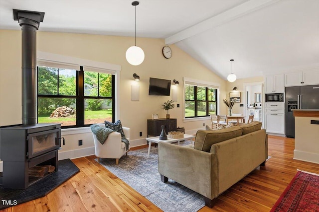 3213 Mid Pines Rd, Raleigh, NC 27606 - living area with a wood stove and light wood finished floors