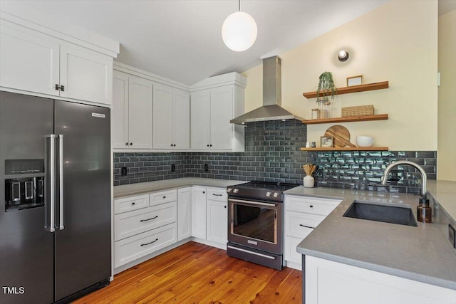 3213 Mid Pines Rd, Raleigh, NC 27606 - kitchen with stainless steel appliances, wall chimney range hood, decorative backsplash, white cabinetry, and lofted ceiling