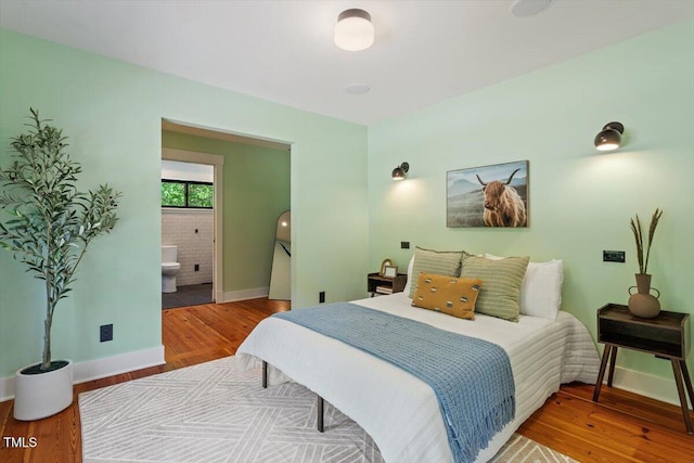 3213 Mid Pines Rd, Raleigh, NC 27606 - bedroom with wood finished floors and ensuite bath