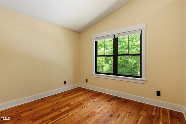 3213 Mid Pines Rd, Raleigh, NC 27606 - unfurnished room featuring lofted ceiling and light wood-style floors