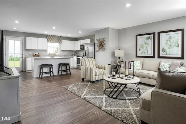 1437 Indigo Creek Dr, Zebulon, NC 27597 - living room with recessed lighting and dark wood-type flooring