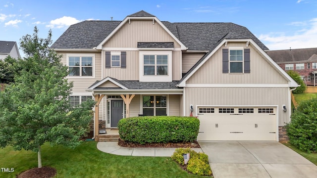 184 Elgin Ct, Burlington, NC 27215 - craftsman inspired home featuring roof with shingles, driveway, a front lawn, a garage, and stone siding