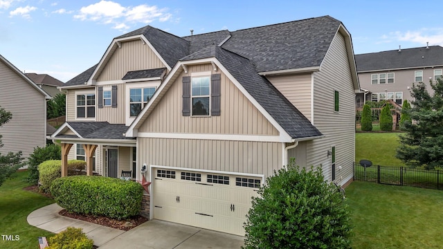 184 Elgin Ct, Burlington, NC 27215 - craftsman-style home featuring roof with shingles, an attached garage, driveway, and board and batten siding
