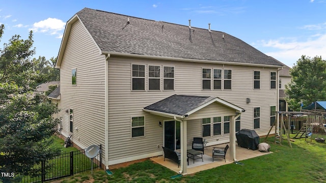 184 Elgin Ct, Burlington, NC 27215 - rear view of property with a patio, a playground, and roof with shingles