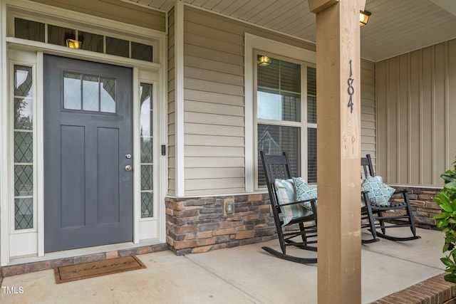 184 Elgin Ct, Burlington, NC 27215 - property entrance with a porch and stone siding