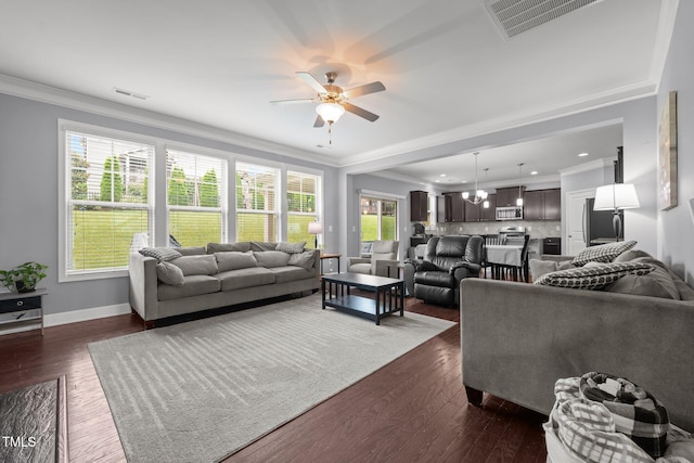 184 Elgin Ct, Burlington, NC 27215 - living room with ceiling fan, crown molding, dark wood finished floors, plenty of natural light, and a chandelier