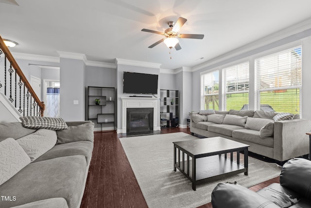 184 Elgin Ct, Burlington, NC 27215 - living area featuring a ceiling fan, stairway, wood finished floors, a fireplace with flush hearth, and ornamental molding
