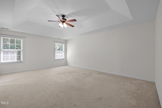 110 Bonhill Ct, Apex, NC 27502 - carpeted spare room featuring a raised ceiling, plenty of natural light, and a ceiling fan
