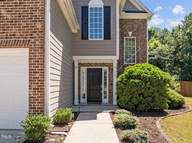 110 Bonhill Ct, Apex, NC 27502 - entrance to property featuring brick siding and a garage