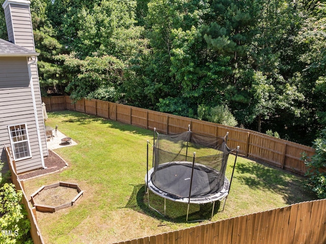 110 Bonhill Ct, Apex, NC 27502 - fenced backyard featuring an outdoor fire pit and a trampoline