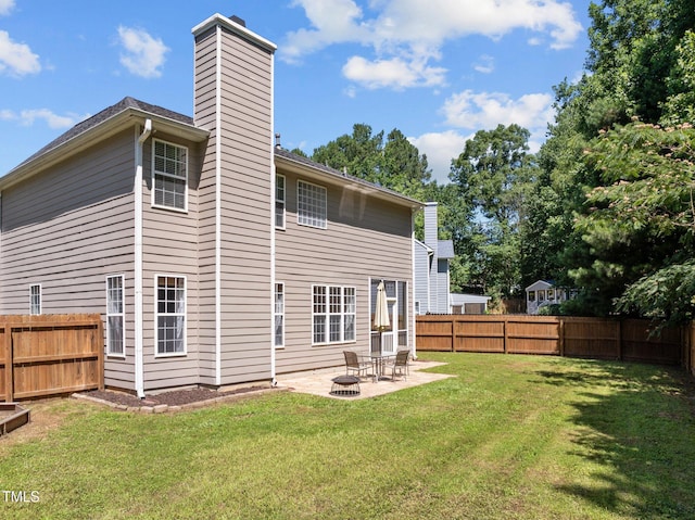 110 Bonhill Ct, Apex, NC 27502 - rear view of house with a fenced backyard, a chimney, and a patio