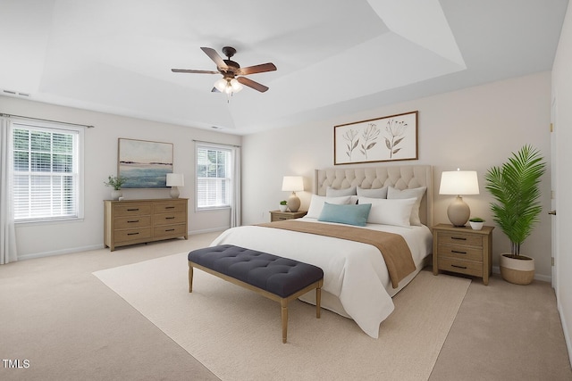 110 Bonhill Ct, Apex, NC 27502 - bedroom with a tray ceiling, carpet flooring, and multiple windows