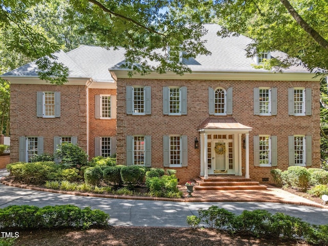 1105 Tazwell Pl, Raleigh, NC 27612 - colonial house featuring brick siding and roof with shingles