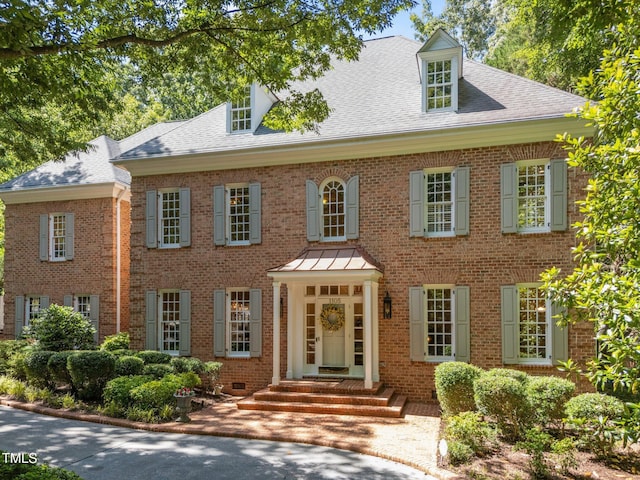 1105 Tazwell Pl, Raleigh, NC 27612 - colonial-style house with brick siding and a shingled roof