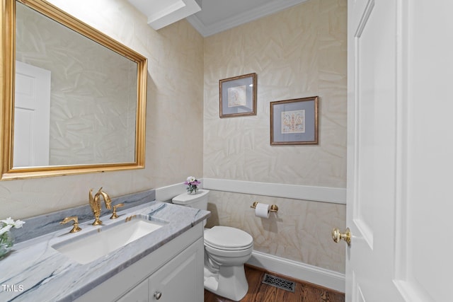 1105 Tazwell Pl, Raleigh, NC 27612 - half bath with vanity, ornamental molding, and wood finished floors