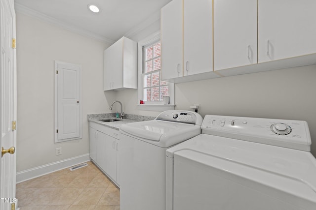 1105 Tazwell Pl, Raleigh, NC 27612 - laundry area featuring washer and clothes dryer, crown molding, cabinet space, light tile patterned floors, and recessed lighting
