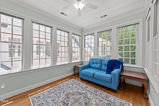 1105 Tazwell Pl, Raleigh, NC 27612 - sunroom with plenty of natural light, crown molding, and wood finished floors