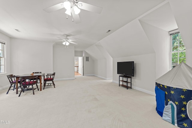 1105 Tazwell Pl, Raleigh, NC 27612 - recreation room with carpet floors, healthy amount of natural light, a ceiling fan, and vaulted ceiling