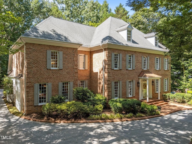 1105 Tazwell Pl, Raleigh, NC 27612 - colonial inspired home featuring brick siding and roof with shingles
