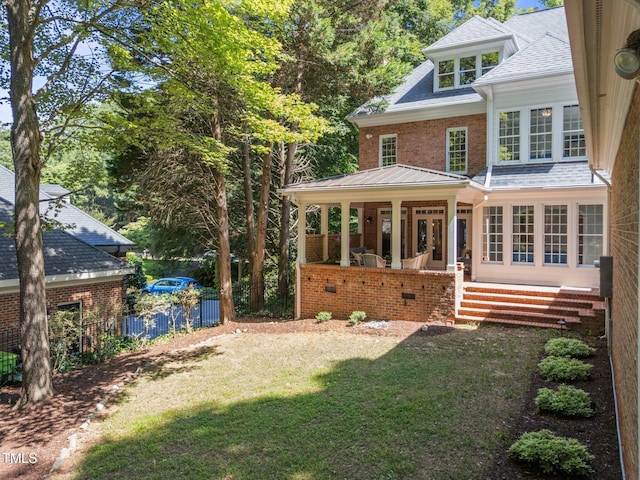 1105 Tazwell Pl, Raleigh, NC 27612 - rear view of house featuring brick siding and a porch