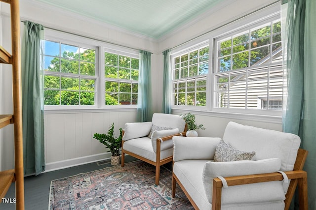 2504 State St, Durham, NC 27704 - living area featuring healthy amount of natural light, ornamental molding, and wood finished floors