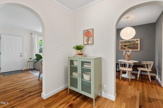 2504 State St, Durham, NC 27704 - entryway featuring arched walkways, wood finished floors, and crown molding