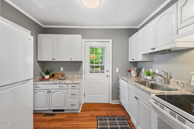 2504 State St, Durham, NC 27704 - kitchen featuring white appliances, light wood finished floors, white cabinets, ornamental molding, and light stone counters