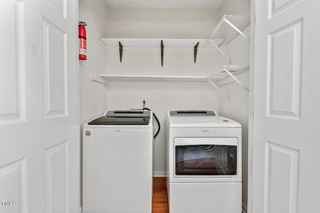 2504 State St, Durham, NC 27704 - washroom featuring independent washer and dryer and wood finished floors