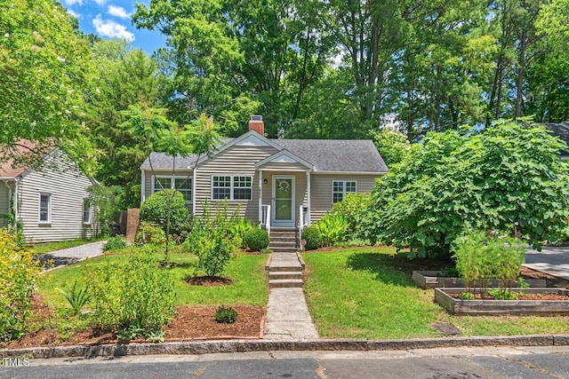 2504 State St, Durham, NC 27704 - view of front of home featuring a chimney and a front lawn