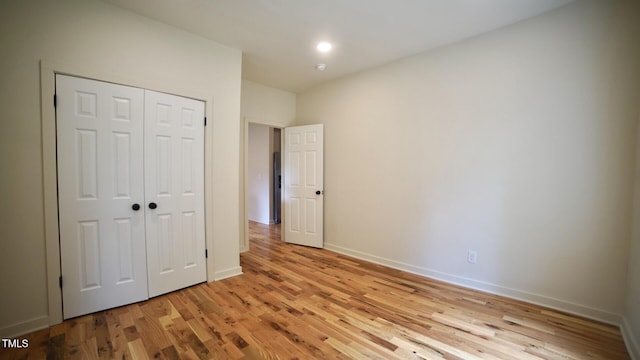 416 Everett St, Burlington, NC 27215 - unfurnished bedroom featuring light wood-style floors and a closet