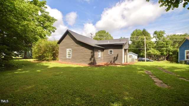 416 Everett St, Burlington, NC 27215 - back of property featuring a lawn and a metal roof