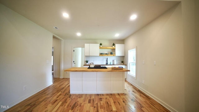 416 Everett St, Burlington, NC 27215 - kitchen featuring butcher block countertops, open shelves, white cabinetry, light wood-type flooring, and recessed lighting