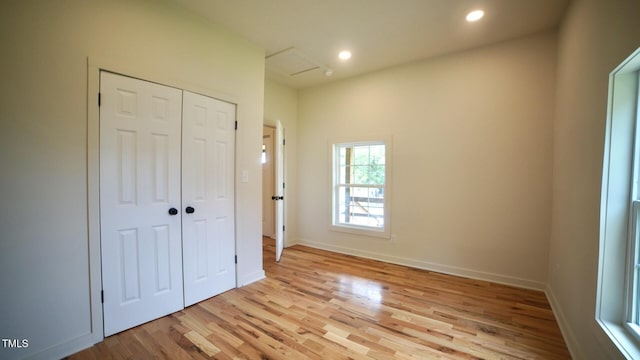 416 Everett St, Burlington, NC 27215 - unfurnished bedroom featuring light wood-type flooring, a closet, recessed lighting, and attic access