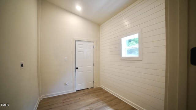 416 Everett St, Burlington, NC 27215 - hallway with wooden walls, lofted ceiling, and wood finished floors