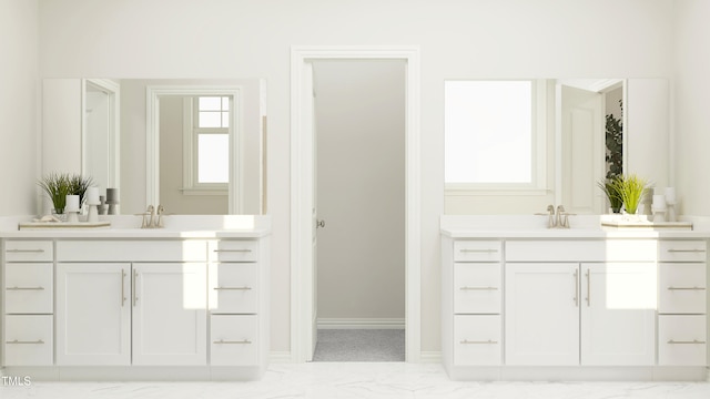 949 Cassa Clubhouse Way, Knightdale, NC 27545 - bathroom featuring two vanities, marble finish floors, and plenty of natural light