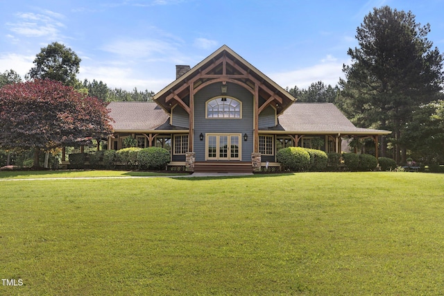 7239 Bulb Rd, Julian, NC 27283 - view of front of home featuring a front lawn, a chimney, and roof with shingles